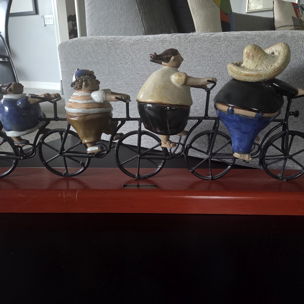 Whimsical Ceramic Cyclists Sculpture